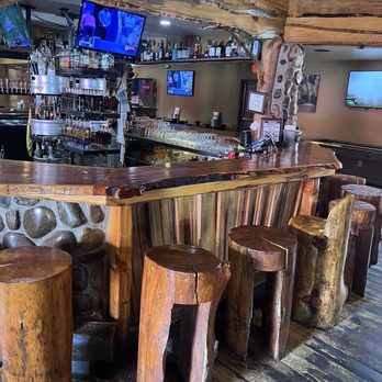 Grand Canyon Brewing & Distillery - Bar seating made from real trees - Brewpubs Near Me - Page, Arizona Grand Canyon Brewing & Distillery - Bar seating made from real trees - Brewpubs Near Me - Page, Arizona