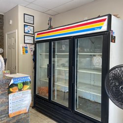 Live Wright Juice Bar - Bare fridge to the right of the counter