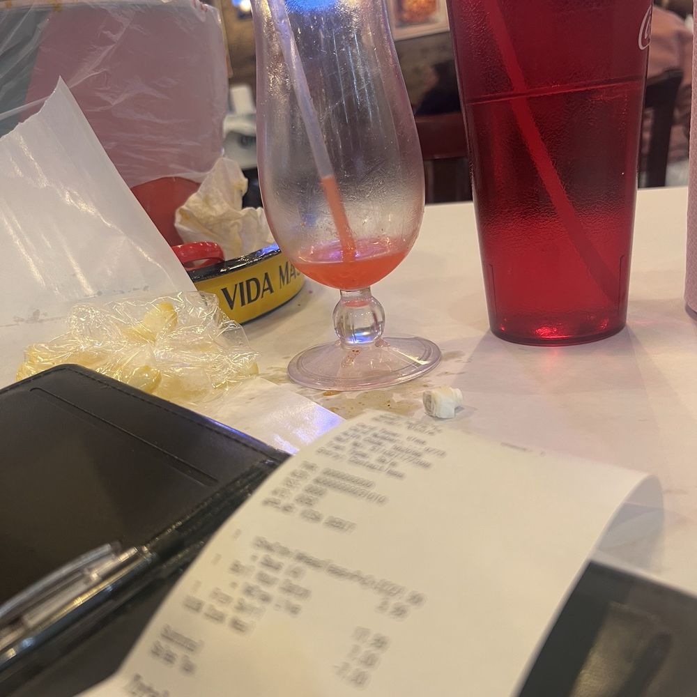 Receipt & empty margarita glass Receipt & empty margarita glass