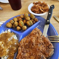 Macs Diner  - Fried pork chop red rice in okra there's also rice with brown gravy only then this picture but I ordered red rice and I got red rice.
