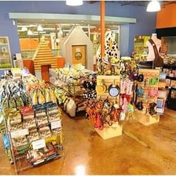Doguroo - Foods, collars, leashes, toys, beds, and more overlook the small and larger dog play areas.