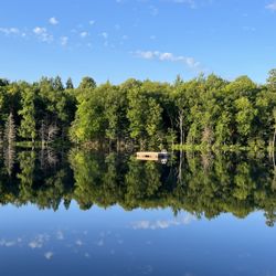 Boot Lake Vacation Rental - Only people out on the lake all week. Water is clear, but almost black. Very stained water. Cottage includes swim platform.