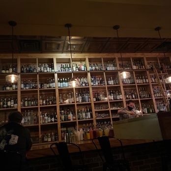 Scotch & Soda - a bar with shelves full of bottles - American Near Me - Bentonville, Arkansas Scotch & Soda - a bar with shelves full of bottles - American Near Me - Bentonville, Arkansas