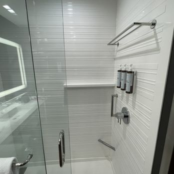 AC Hotel Vancouver Waterfront - Welcome details in the shower - shelf, grab bar, step for your foot for shaving your legs. - Hotels Near Me - Vancouver, Washington AC Hotel Vancouver Waterfront - Welcome details in the shower - shelf, grab bar, step for your foot for shaving your legs. - Hotels Near Me - Vancouver, Washington
