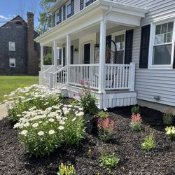 Care Free Homes - Finished front porch with new shutters and gutters