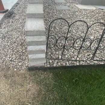 Steele Paving - Heavy cement hose hit against brick fence repeatedly forcing it into iron pushing entire fence out of alignment. Dug groove in HOA rock. - Masonry/Concrete Near Me