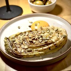 Hollow - I wish I had taken a picture of the menu. This is a kimchi cabbage slice w I think pistachios. Delish.