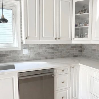 NC Hammer - a kitchen with white cabinets and a stainless steel dishwasher - General Contractors Near Me - Ottawa, Ontario NC Hammer - a kitchen with white cabinets and a stainless steel dishwasher - General Contractors Near Me - Ottawa, Ontario
