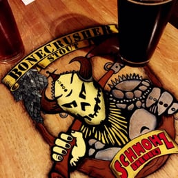 a beer glass and a sign a beer glass and a sign
