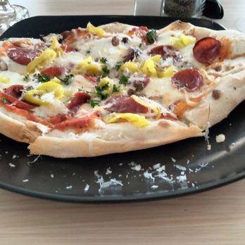 Brazen brewing - Brewer's favorite pizza...red sauce with pepperoni, banana peppers, mozzarella and garlic strips. Stretched to an oval. - Breweries Near Me - Lancaster, New York