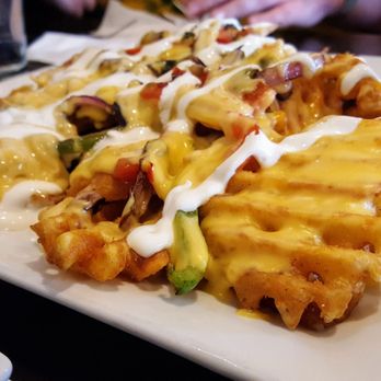 Schuggys American Grill & Taphouse - Wachos: waffle fries, nacho style (ordered without bacon) - Sports Bars Near Me - Hammond, Wisconsin Schuggys American Grill & Taphouse - Wachos: waffle fries, nacho style (ordered without bacon) - Sports Bars Near Me - Hammond, Wisconsin