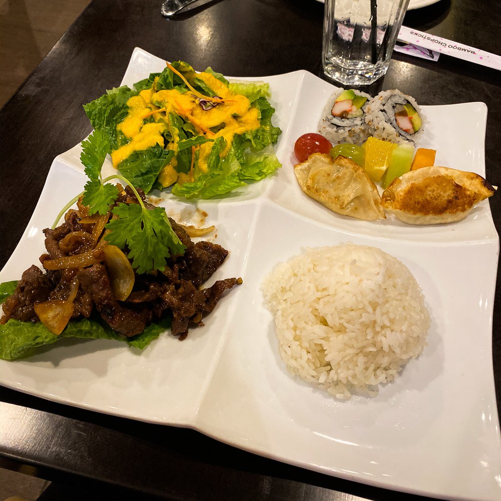 Green salad with ginger dressing, 2 pieces of California roll, 2 vegetable gyoza, fruit skewer, white rice, beef bulgogi with grilled onion.