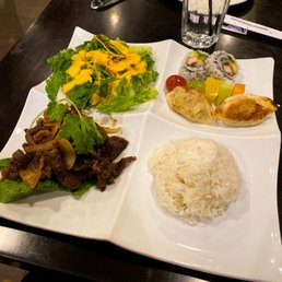 Green salad with ginger dressing, 2 pieces of California roll, 2 vegetable gyoza, fruit skewer, white rice, beef bulgogi with grilled onion.