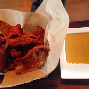 Carson Kitchen - Crispy chicken skin with smoked honey dipping sauce - New American Near Me - Las Vegas, Nevada Carson Kitchen - Crispy chicken skin with smoked honey dipping sauce - New American Near Me - Las Vegas, Nevada