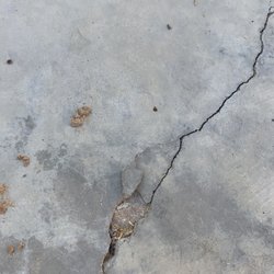 Olympic Systems - Top layer seems to be breaking away. This would be the middle of my living room.