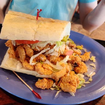 Peck's Seafood Restaurant - Shrimp piled high on the Po boy. - Cajun/Creole Near Me - Slidell, Louisiana Peck's Seafood Restaurant - Shrimp piled high on the Po boy. - Cajun/Creole Near Me - Slidell, Louisiana