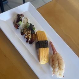 Bbq eel nigiri, tamago nigiri, & sweet shrimp nigiri Bbq eel nigiri, tamago nigiri, & sweet shrimp nigiri
