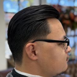 The Barber Shop - Classic men's haircut with detailed shear work, a clean taper, and a polished side-part finish at The Barber Shop in Santa Barbara.