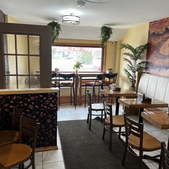 Rise & Grind - tables and chairs in a restaurant - Coffee & Tea Near Me - Buffalo, New York