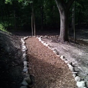 McGraw Construction Group - a pathway in the woods - Landscaping Near Me
