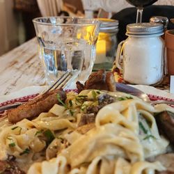 Maison Provence - Duck breast fettuccini paired with a red wine