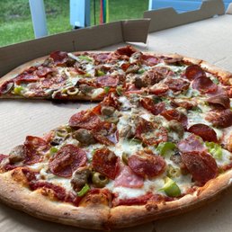 Deluxe pizza.. with a piece missing Deluxe pizza.. with a piece missing