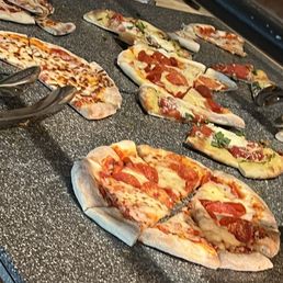 Yummy assorted pizza options Yummy assorted pizza options