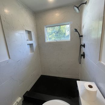 Aligned Home Improvement - a bathroom with a toilet and sink - General Contractors Near Me - East Northport, New York Aligned Home Improvement - a bathroom with a toilet and sink - General Contractors Near Me - East Northport, New York