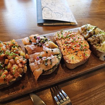 Postino Addison - From left, seasonal, smoked salmon, sweet chile goat cheese, French onion. All great! - Wine Bars Near Me - Dallas, Texas Postino Addison - From left, seasonal, smoked salmon, sweet chile goat cheese, French onion. All great! - Wine Bars Near Me - Dallas, Texas