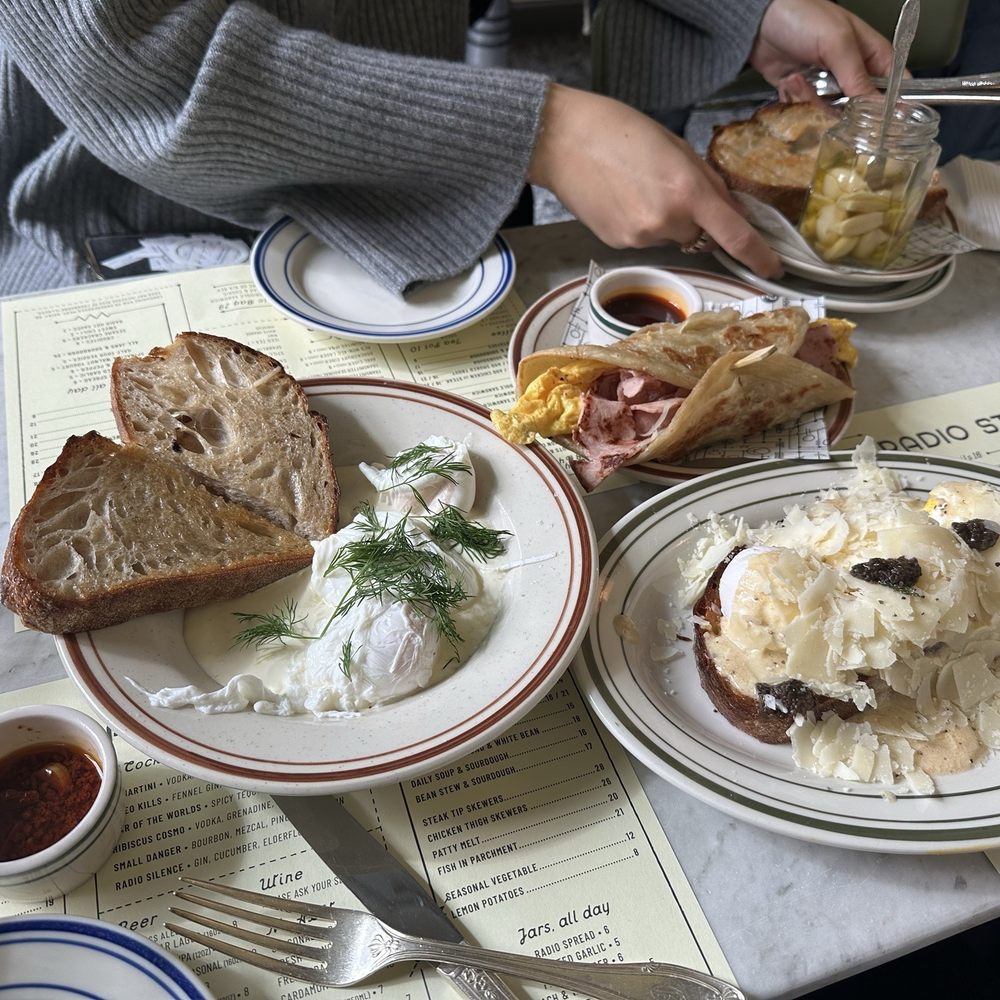 Radio Star - Truffle egg toast, Poached eggs, harissa & yogurt, Ham & egg Griddle Sandwich and Roasted Garlic jar - Diners Near Me - Brooklyn, New York