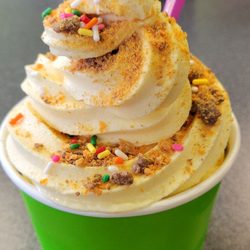 Cake batter frozen yogurt with butterfinger topping and rainbow sprinkles