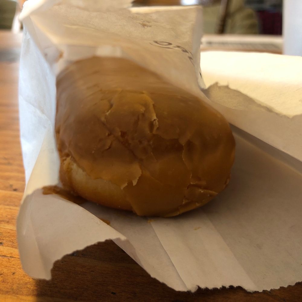 Gilroy Donut House - a glazed donut in a paper wrapper - Donuts Near Me - Gilroy, California Gilroy Donut House - a glazed donut in a paper wrapper - Donuts Near Me - Gilroy, California