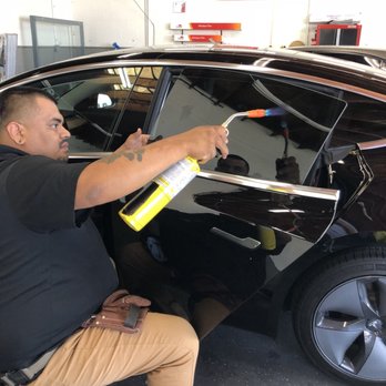 Elevance - Tinting my Tesla Model 3. Tech using a torch to speed the drying time! No more waiting to roll down the windows. - Vehicle Wraps Near Me - Cypress, California Elevance - Tinting my Tesla Model 3. Tech using a torch to speed the drying time! No more waiting to roll down the windows. - Vehicle Wraps Near Me - Cypress, California