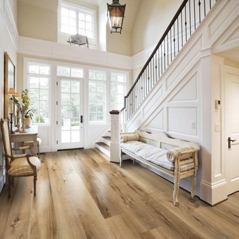 Thornton Flooring - a view of a hallway with a couch and a staircase - Carpeting Near Me - Tea, South Dakota