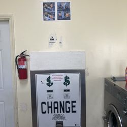 Kapalama Launderette - no sign that says for every $1 dollar change, you receive 75 cents