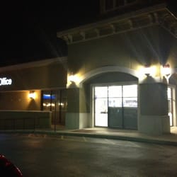 FedEx Office Print & Ship Center - Storefront at night.
