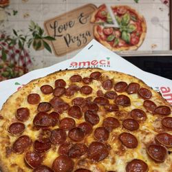 Pan pizza, Ameci signature mozzarella cheese, homemade pizza sauce, topped with delicious cup & char pepperonis.