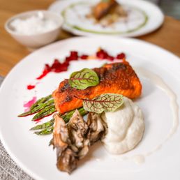 Stage Restaurant - a plate of food on a table - food, grilled fish - New American Near Me - Honolulu, Hawaii