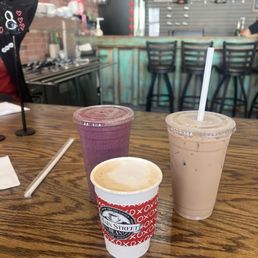 An iced chai tea latte, a vanilla hot coffee, and a blu-nana smoothie