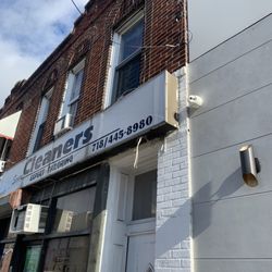 Seven Cleaners - Sign above (inaccurate phone number)