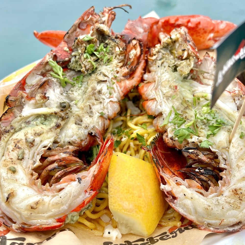 Lobsterdamus - Lobster Nest (Whole - $42). Delicious, tender, mesquite-grilled lobster with a side of clarified butter. Sits on a bed of garlic noodles. - Seafood Near Me - Costa Mesa, California