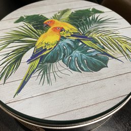 a parrot on a palm leaf