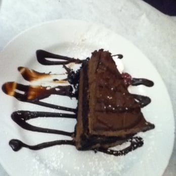 Rubaiyat - The chocolate coma cake. Not what it's called but it has soo much chocolate in it!! - New American Near Me - Decorah, Iowa