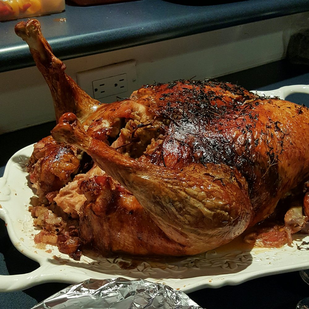 a roasted turkey on a platter a roasted turkey on a platter