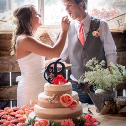 Civil War Ranch - Bride and groom share some wedding cake in the Wedding Barn at the Civil War Ranch in Carthage, MO.