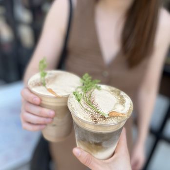 Dialogue Coffee & Flowers - Chai and hojicha lattes, both with carrot cake cold foam on top - Coffee & Tea Near Me - New York, New York Dialogue Coffee & Flowers - Chai and hojicha lattes, both with carrot cake cold foam on top - Coffee & Tea Near Me - New York, New York