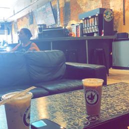 a person sitting in a coffee shop a person sitting in a coffee shop