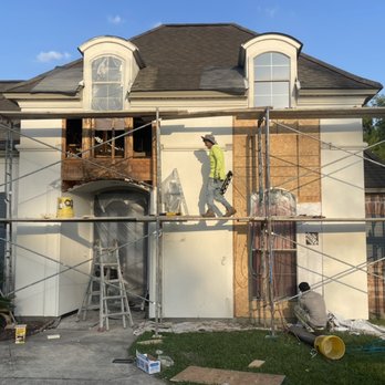 Hector Sanchez Stucco - two men on scaffolding in front of a house - Stucco Services Near Me - Gonzales, Louisiana Hector Sanchez Stucco - two men on scaffolding in front of a house - Stucco Services Near Me - Gonzales, Louisiana