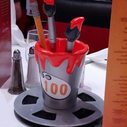 an ice cream bucket with tools in it