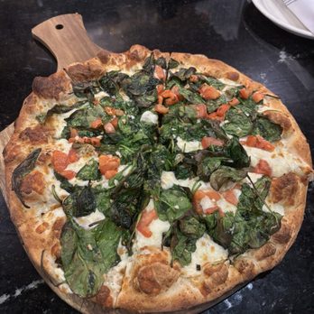 The Palazzo Ristorante - White pizza with tomatoes spinach and garlic - Pizza Near Me - Schenectady, New York The Palazzo Ristorante - White pizza with tomatoes spinach and garlic - Pizza Near Me - Schenectady, New York
